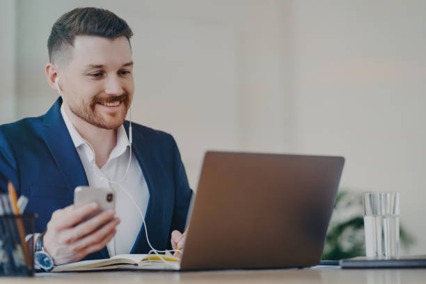 istock Happy businessman having video conference call while working at office 1470204699