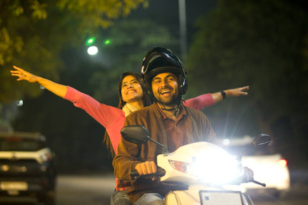 istock Happy couple enjoying motorcycle ride at night 1470205765