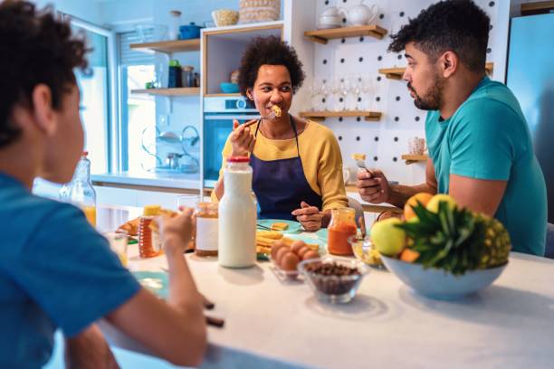 istock Happy black family having breakfast in the kitchen 1470207141