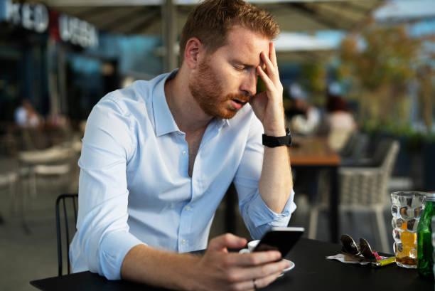 istock Worried man using the phone. 1470208583