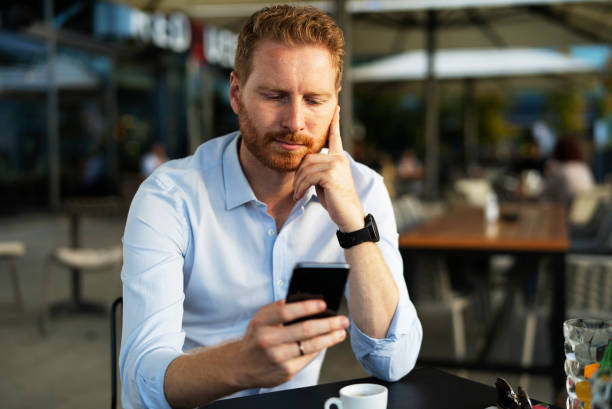 istock Worried man using the phone. 1470208598