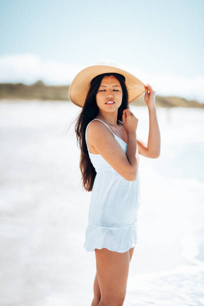 istock tourist with panama hat at the beach 1470208966