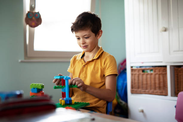 istock Adorable boy playing with toys at home. 1470209742