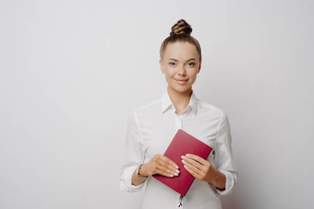 istock Female accountant in white shirt and notebook 1470209843