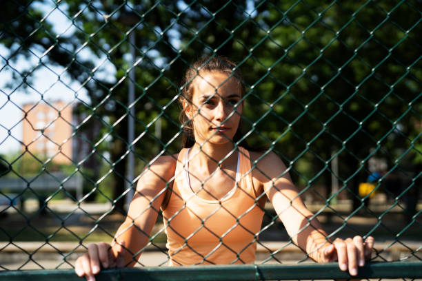 istock Young woman stretching in the park. 1470210485