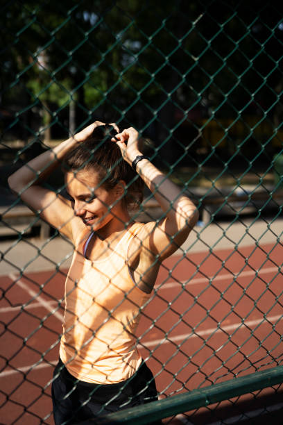 istock Young woman stretching in the park. 1470210527
