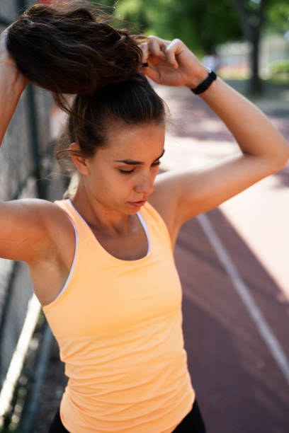 istock Young woman stretching in the park. 1470210533