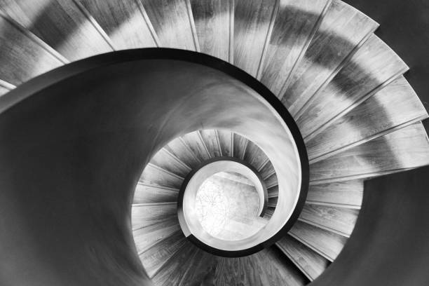 istock black and white spiral staircase from above 1470211366