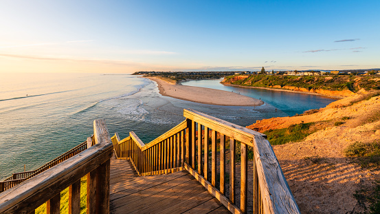 South Port beach boardwalk viewed towards Onkaparinga River at sunset, South Australia