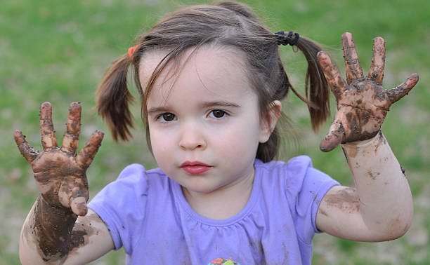 istock Little Girl with Muddy Hands 147021553