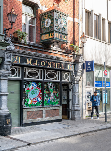 O’Neill’s traditional Old Irish Pub and clock, Dublin, Ireland