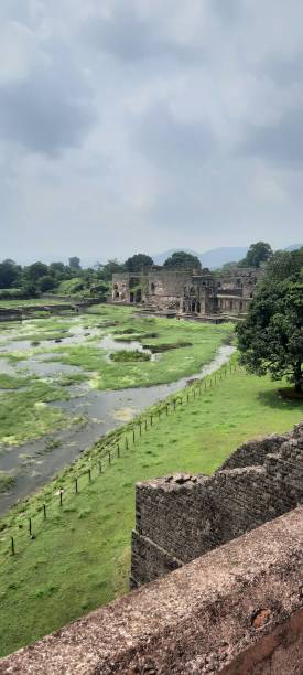 istock Broken heritage kingdom walls under the clouds beside a lake 1470219162