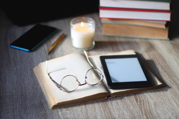 istock Books, Tablet, Glasses, Phone, Laptop and Candle 1470219461