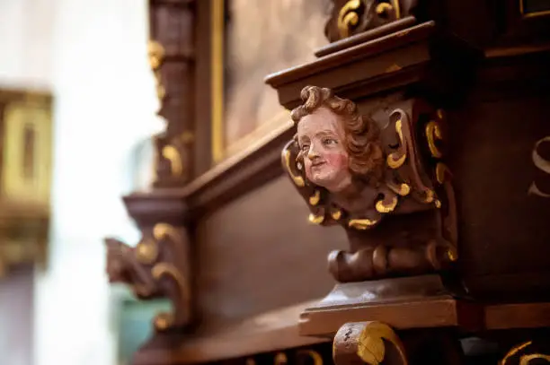 interiors and details in catholic church baroque face carving in wood
