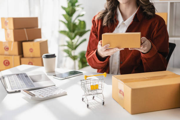 istock Startup or Small Business Entrepreneur prepare to deliver with parcel box note delivery address from customer, manage orders in online store, internet shopping, SME business concept, e-commerce. 1470221043