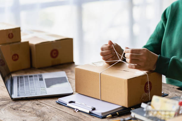 istock Startup or Small Business Entrepreneur prepare to deliver with parcel box note delivery address from customer, manage orders in online store, internet shopping, SME business concept, e-commerce. 1470221255