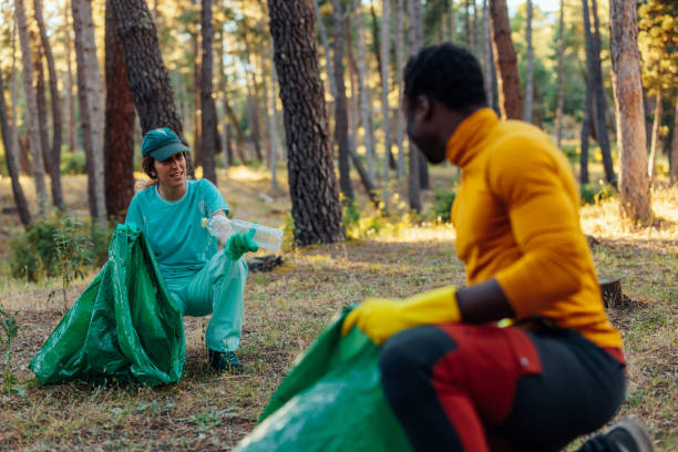 istock Activist couple cleaning nature. 1470221260