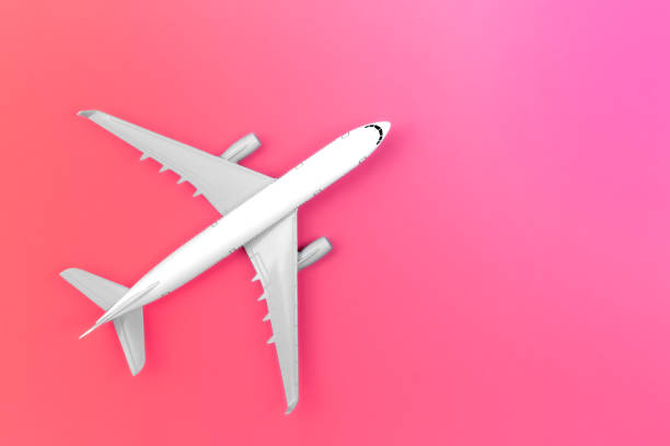 istock Airplane on a pink background, flat lay, travel concept. 1470222344