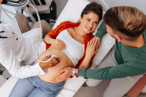 istock Happy couple at pregnancy exam. 1470222482