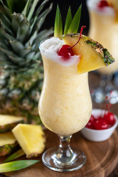 istock Pina colada cocktail with cherry, pineapple and leaves 1470222677