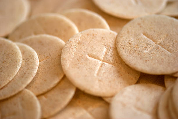 Communion Wafers Closeup of Communion wafers. communion stock pictures, royalty-free photos & images