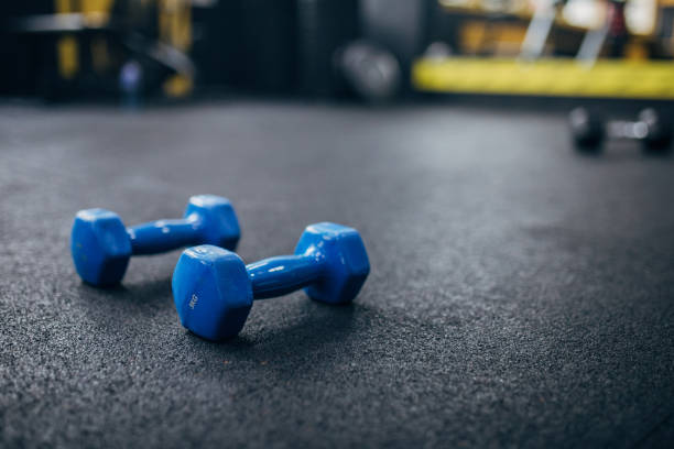 istock Dumbbells on the floor in gym 1470225432