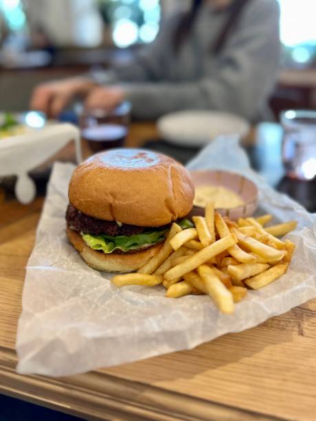 istock hamburger with fries in a cafe 1470227188