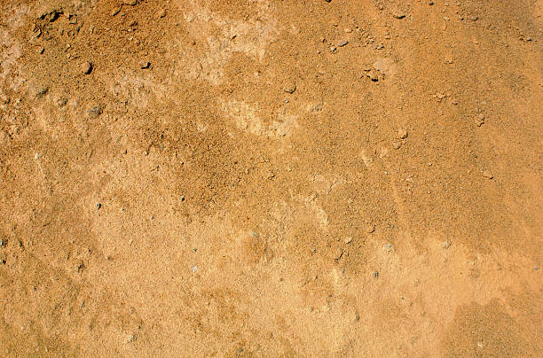 fondo marrón rojizo suciedad - piedra material de construcción fotos fotografías e imágenes de stock