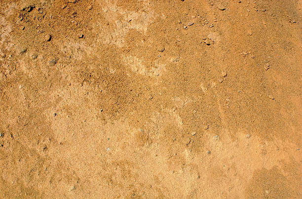 reddish brown dirt background - toprak stok fotoğraflar ve resimler