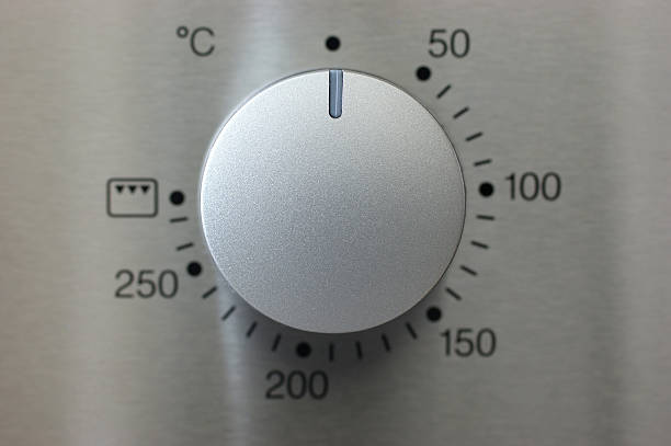 silver knob a silver knob of a oven taken with macro lens knob photos stock pictures, royalty-free photos & images