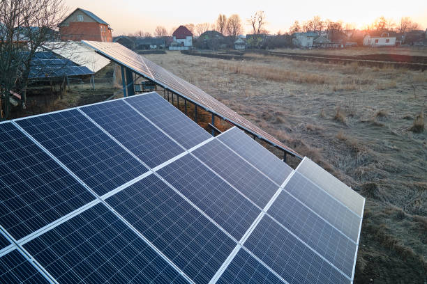 istock Solar photovoltaic panels mounted on stand-alone frame on backyard ground for generating of clean ecological electric energy. Concept of autonomous house 1470234622