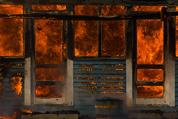 Front doors of a burning house stock photo