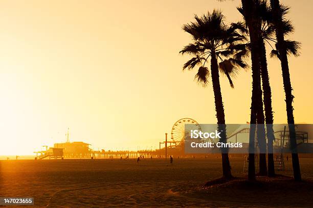 The Santa Monica Pier At Sunset Stock Photo - Download Image Now - Back Lit, Beach, City Of Los Angeles