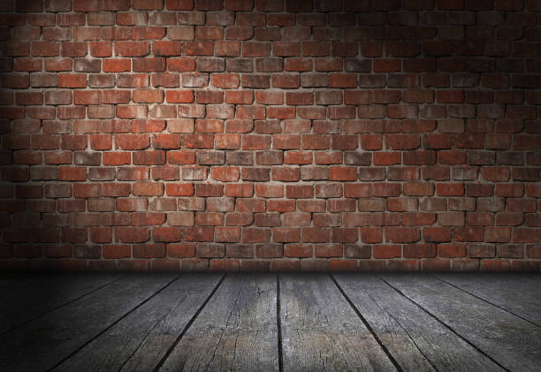 istock Dark scene with spotlight on red brick wall background. Empty bricks room with old wooden floor 1470237542