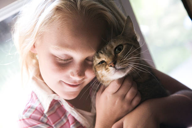 istock Young girl with cat 147023790