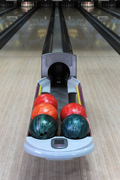 bowling balls and alley on background stock photo