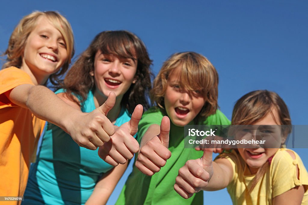 happy group of kids happy group of kids with thumbs up at summer camp Blue Stock Photo