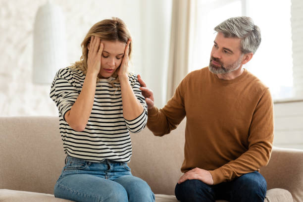 istock Wife Suffering From Headache, Husband Caring For Her At Home 1470240971
