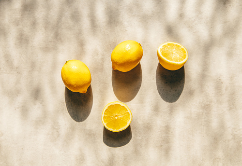 Fresh lemons citrus fruit in warm sunlight