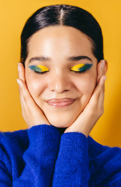 istock Loving her makeup look, woman embraces her face in a studio 1470241151