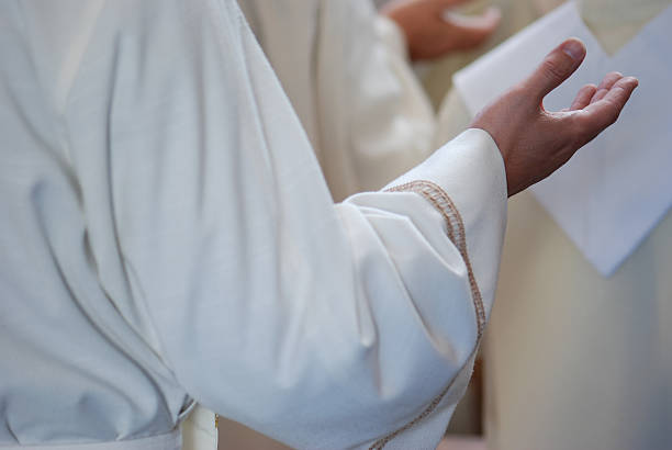 istock Hands of Priest in Prayer 147024154