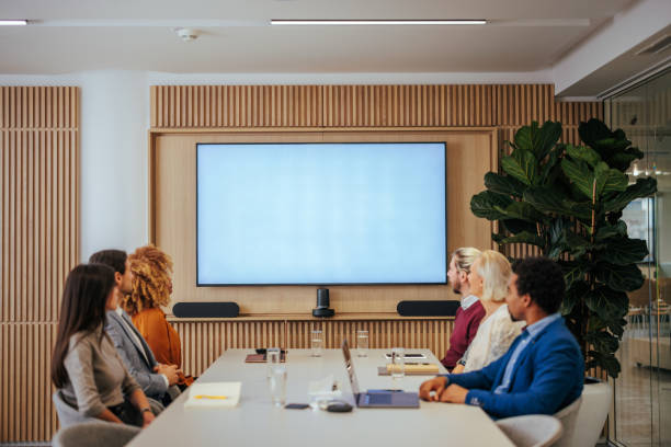 istock Businesspeople watching screen in meeting room. 1470243112