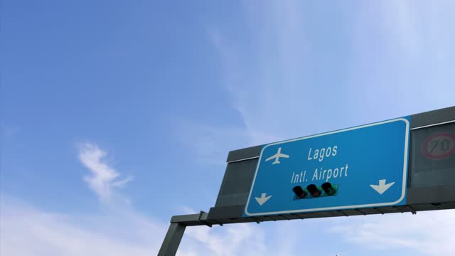 plane flying over lagos airport sign