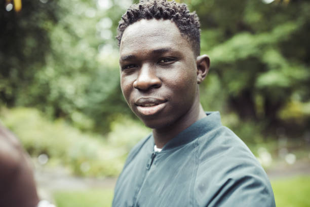 istock Young African man in park. Fall or spring season 1470244347