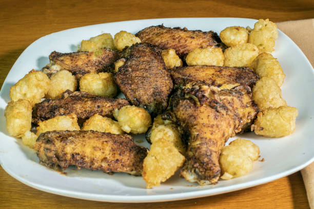 istock chicken wings  with golden tater tots 1470247148