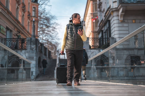 istock Senior Asian Male Tourist Looking For Help 1470248871