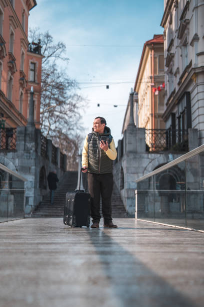 istock Senior Asian Male Tourist Looking For Help 1470248946