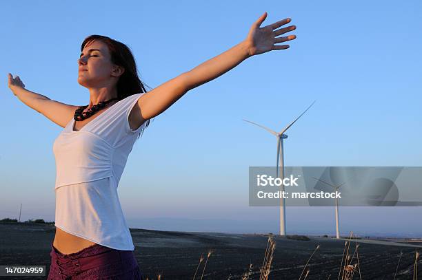 Woman And Wind Turbines Stock Photo - Download Image Now - One Woman Only, 25-29 Years, 30-34 Years