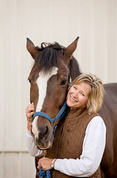 istock Woman With Her Horse 147025066