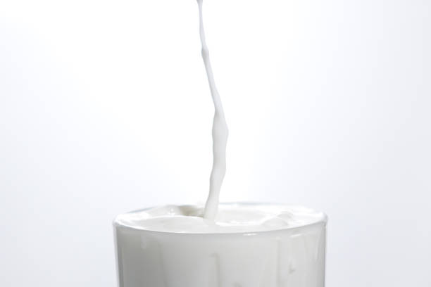 istock Drop in glass of milk 1470252214